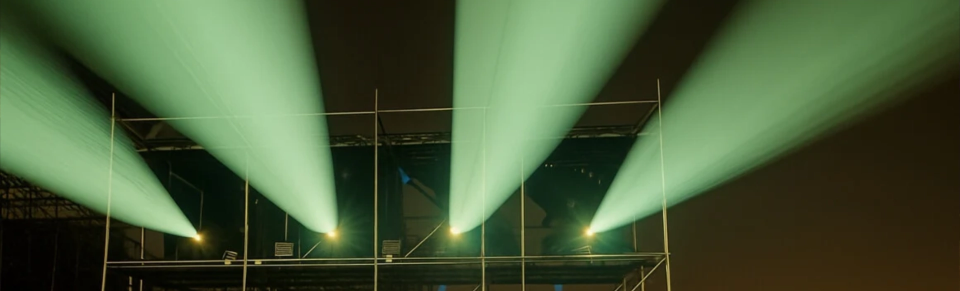 High-lumen laser projectors rigged for outdoor building projection mapping in Dubai